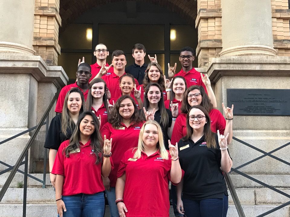 A group of students pose together.